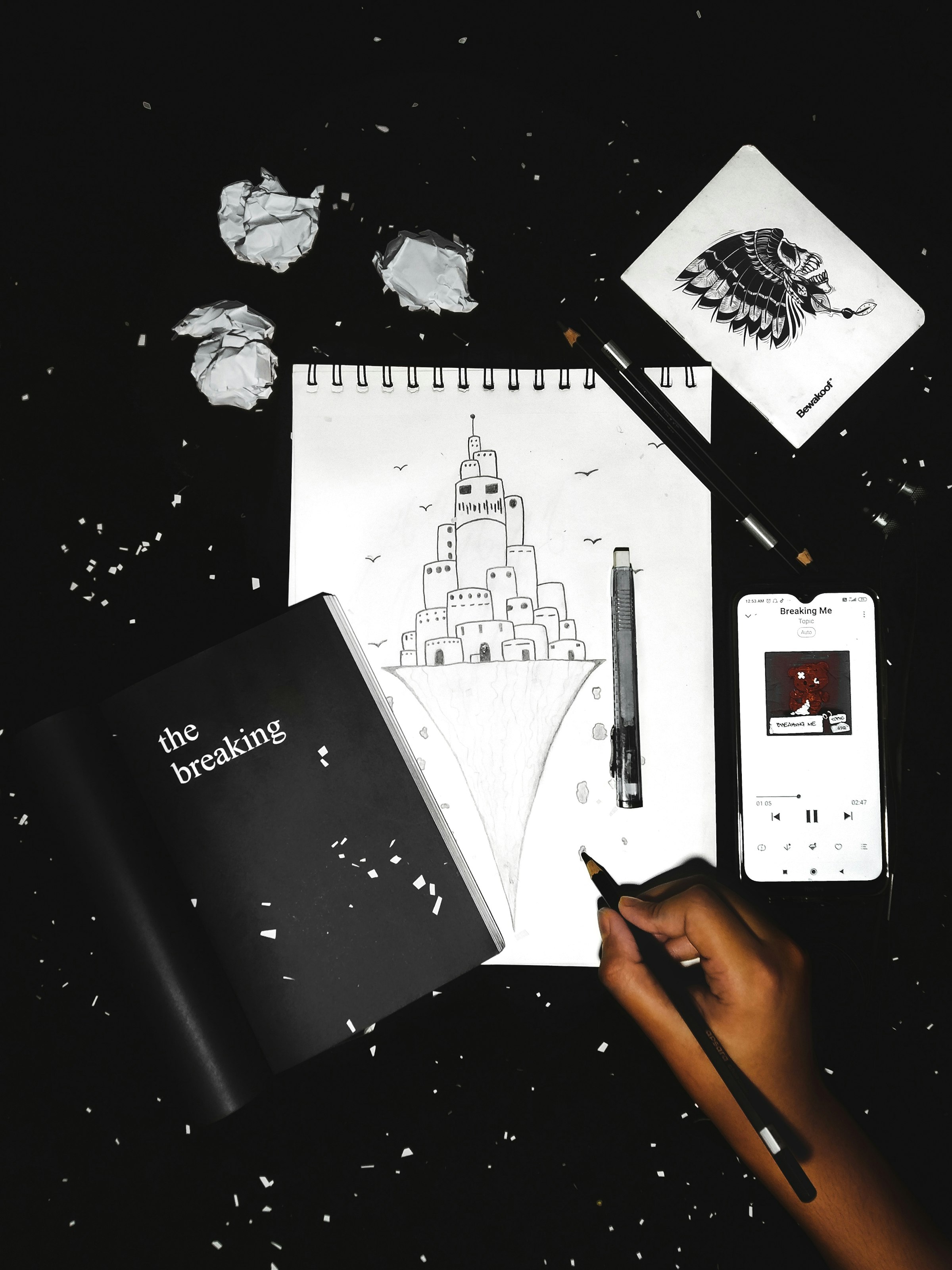 A hand sketching a concept on paper — the first step of any idea Elysée co-develops with external inventors and partners.