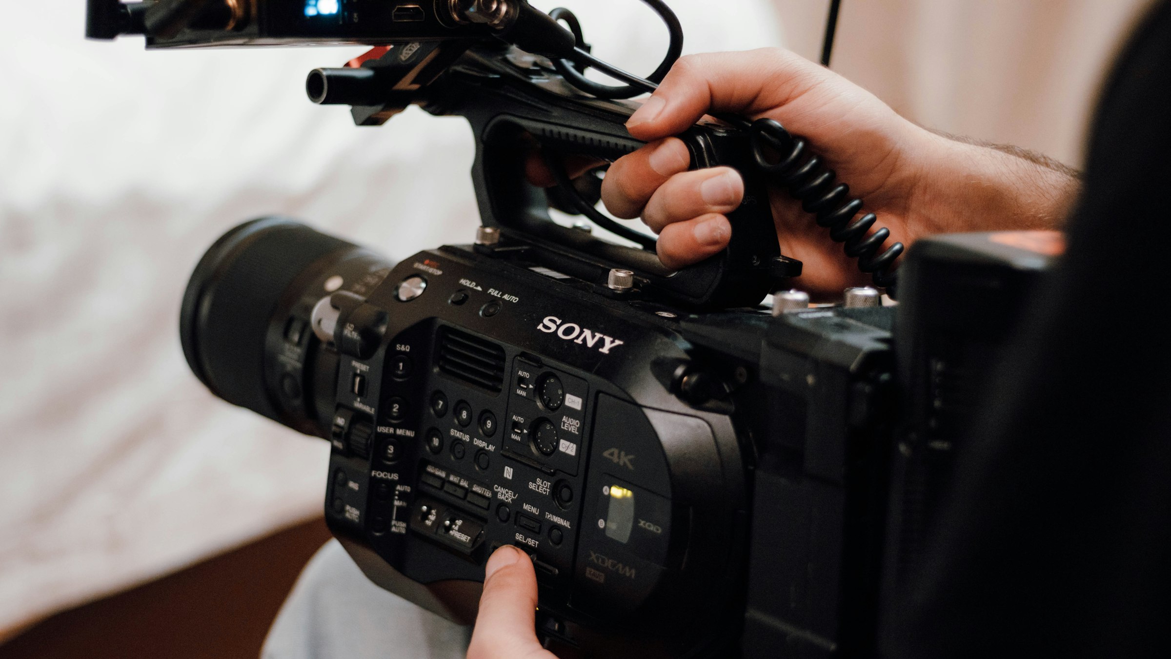 A professional cinema camera being operated on set.